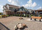 Thumbnail 30 of 47 - A park area with a bench and a fire hydrant at The Edison at Spirit, Lakeville Minnesota