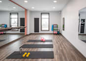 Thumbnail 15 of 24 - A yoga studio with mats and yoga balls at The Edison at Woodbury, Minnesota, 55129
