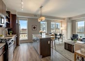 Thumbnail 32 of 100 - Kitchen along with living room at The M on Hennepin, Minnesota, 55414