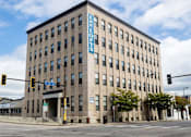 Thumbnail 17 of 20 - A Lee Lofts building is shown with a blue sign on the side.