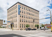 Thumbnail 5 of 20 - A large building with the name "LES LOFTS" on the side of it.