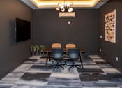 Thumbnail 12 of 47 - A conference room with a checkered floor and a television on the wall at The Redwell Apartments, Minneapolis, MN