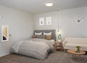 Thumbnail 20 of 47 - A bedroom with a large bed and a white couch at The Redwell Apartments, Minnesota