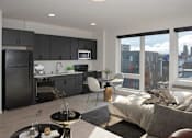 Thumbnail 31 of 47 - A modern kitchen with a dining area and a view of the city at The Redwell Apartments, Minneapolis, Minnesota