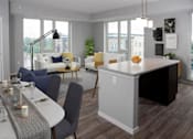 Thumbnail 10 of 54 - A modern kitchen with a dining table and chairs.