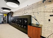 Thumbnail 34 of 54 - A black and white map is on the wall behind a black counter.