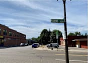 Thumbnail 54 of 54 - A street view of Payne Avenue with cars parked on the side of the road.