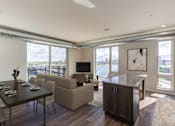 Thumbnail 3 of 36 - Living Room with a Dining Table at Peregrine Apartments, Minneapolis