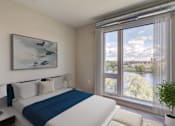 Thumbnail 5 of 36 - A Bedroom with a View of the City at Peregrine Apartments, Minneapolis, Minnesota