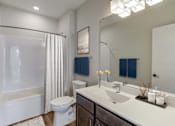 Thumbnail 10 of 36 - Bathroom with a White Toilet at Peregrine Apartments, Minneapolis, MN