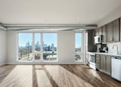 Thumbnail 13 of 36 - Kitchen with a View of the City at Peregrine Apartments, Minnesota, 55411