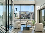 Thumbnail 18 of 36 - A Modern Interior with a Glass Wall at Peregrine Apartments, Minnesota
