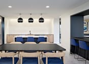 Thumbnail 25 of 36 - Dining Area with a Large Table at Peregrine Apartments, Minneapolis