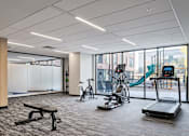 Thumbnail 31 of 36 - A Gym with Treadmills at Peregrine Apartments, Minneapolis, MN