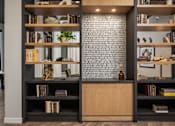 Thumbnail 55 of 55 - A bookshelf with books and decorative items is shown.