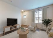 Thumbnail 109 of 113 - A living room with a television, a chair, a table, and a plant.