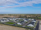 Thumbnail 104 of 113 - A large, modern housing development with multiple houses and a spacious layout.