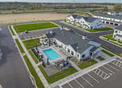 Thumbnail 94 of 113 - A large building with a pool in front of it.