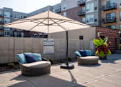 Thumbnail 18 of 60 - Shaded Lounge Area By Pool at The McMillan, Shoreview, Minnesota