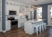 Thumbnail 21 of 60 - Kitchen With White Cabinetry And Appliances at The McMillan, Minnesota, 55126