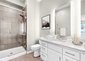 Thumbnail 53 of 123 - A bathroom with a white toilet and a white sink.