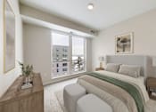 Thumbnail 40 of 64 - A bedroom with a large bed and a window overlooking a cityscape.