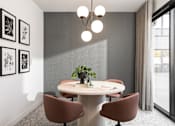Thumbnail 12 of 64 - A modern dining room with a round table and chairs.
