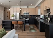 Thumbnail 27 of 64 - A modern kitchen with a black countertop and wooden cabinets.