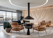 Thumbnail 6 of 64 - A modern living room with a fireplace and comfortable seating.