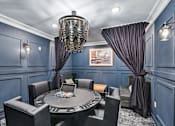 Thumbnail 11 of 102 - A dining room with a round table and chairs.