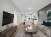 Thumbnail 58 of 91 - A modern living room with a grey couch and a coffee table.