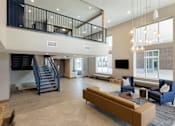 Thumbnail 54 of 60 - Lounge With Stairs at The McMillan Apartments in Shoreview, MN 55126