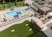 Thumbnail 19 of 60 - Aerial View of Pool and Patio at The McMillan Apartments in Shoreview, MN 55126