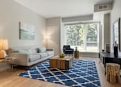 Thumbnail 30 of 60 - Living Room With Large Windows at The McMillan Apartments in Shoreview, MN 55126