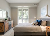 Thumbnail 34 of 60 - Master Bedroom With Balcony at The McMillan Apartments in Shoreview, MN 55126