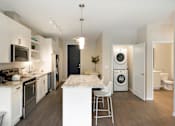 Thumbnail 41 of 60 - Kitchen and Laundry Space at The McMillan Apartments in Shoreview, MN 55126
