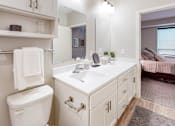 Thumbnail 11 of 91 - a bathroom with white cabinets and a white toilet at The Morrison, Rosemount, 55068