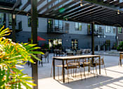 Thumbnail 75 of 91 - an outdoor patio with tables and chairs at The Morrison, Minnesota, 55068