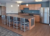 Thumbnail 11 of 26 - Community kitchen with serving bar perfect for entertaining