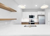 Thumbnail 30 of 97 - A modern kitchen with a large island in the center.