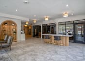 Thumbnail 2 of 45 - A spacious interior with a bar area and seating.