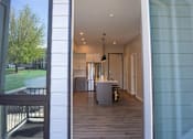 Thumbnail 36 of 45 - A modern house with a glass door entrance.