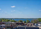 Thumbnail 29 of 45 - A view of downtown Waconia with a lake in the background.