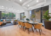 Thumbnail 104 of 105 - a dining area with a table and chairs and a living room with a couch