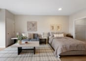 Thumbnail 3 of 105 - a bedroom with a bed and a couch