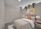 Thumbnail 51 of 105 - a bedroom with grey walls and a bed with a white comforter