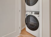 Thumbnail 75 of 105 - a washer and dryer in a small laundry room