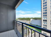 Thumbnail 66 of 105 - a balcony with a view of a city
