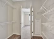 Thumbnail 25 of 105 - a walk in closet at the enclave at woodbridge apartments in sugar land, tx