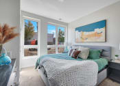 Thumbnail 20 of 105 - a bedroom with a large bed and a large window